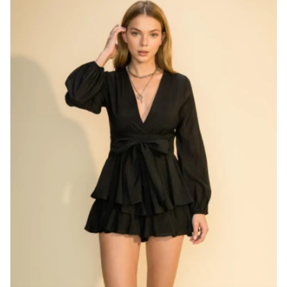 Black long sleeve tiered romper with back tie belt detail